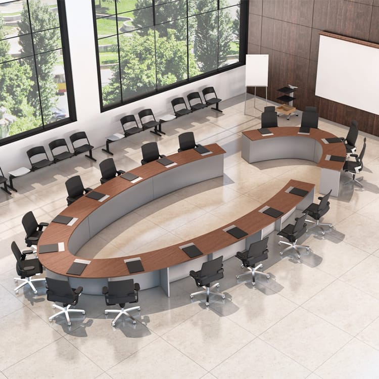 Overhead view of a wood-grain Cosmos Conference table with black chairs.