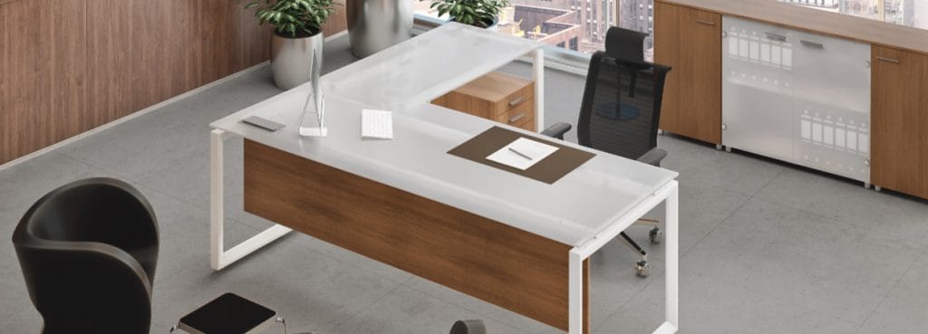 Modern Cubiko Managerial desk with white frame, wood panel, and a glass top for private offices and studio spaces.