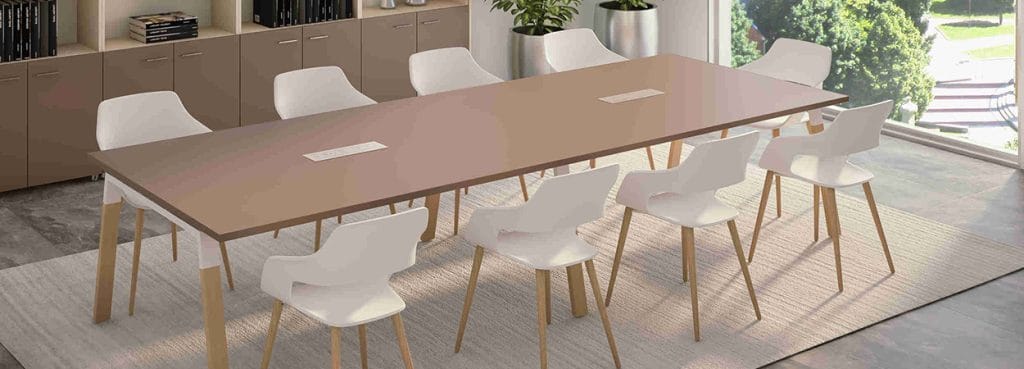Lamda Conference table with white chairs. Modern design for collaboration spaces.