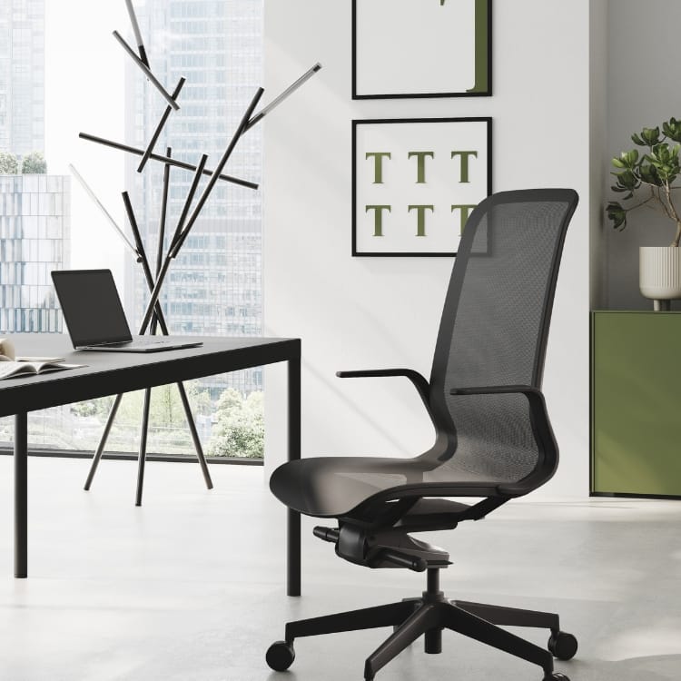 Modern office with black Trama executive chair, desk, and city view. Minimalist style.