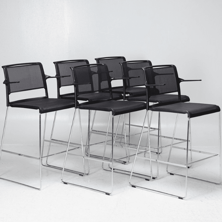 Six black Aline Stools with chrome frames, offering sleek, modern seating for social and relaxed spaces.