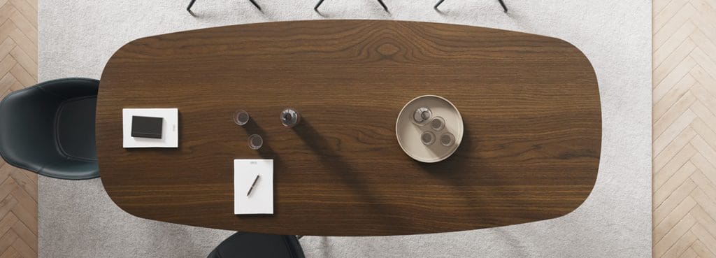 Overhead shot of a wood Archimede Conference Table in a modern office setting.