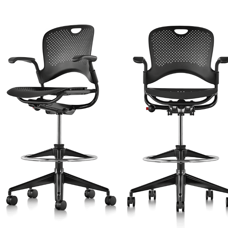 Two black Caper Stools with armrests, adjustable height, and breathable design.