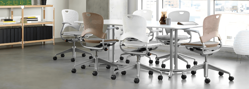 Herman Miller Caper chairs in a conference room. Versatile seating with rolling casters.