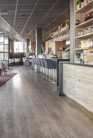 Stylish Bars with seating, wood floors, and a modern design. Perfect for hospitality spaces.