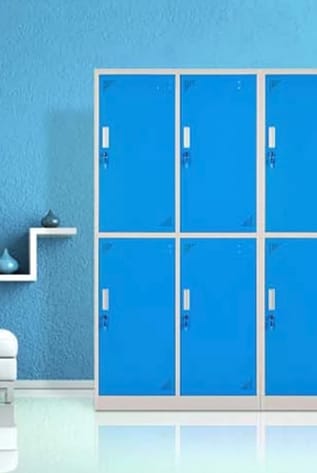 Blue metal lockers with secure locking mechanisms for organized storage.