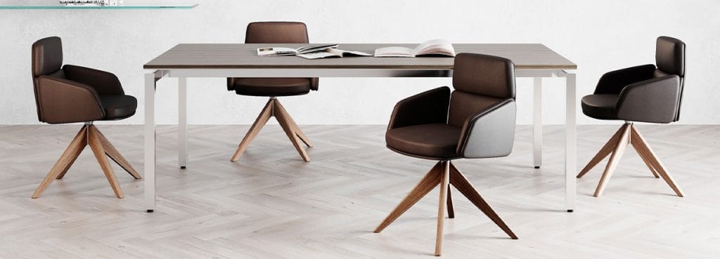 Lead executive chairs in brown leather with wood base around a modern conference table.