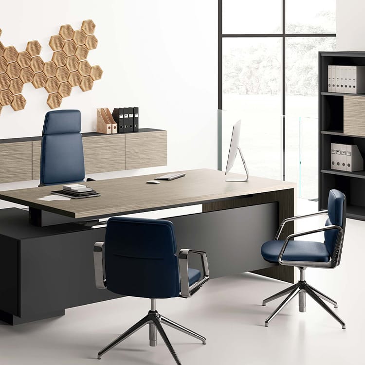 Modern Elite office setup. Wood desk with blue chairs, sleek design.