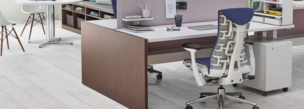 Ergonomic blue Embody chair with a white frame and a unique back design in an office setting.