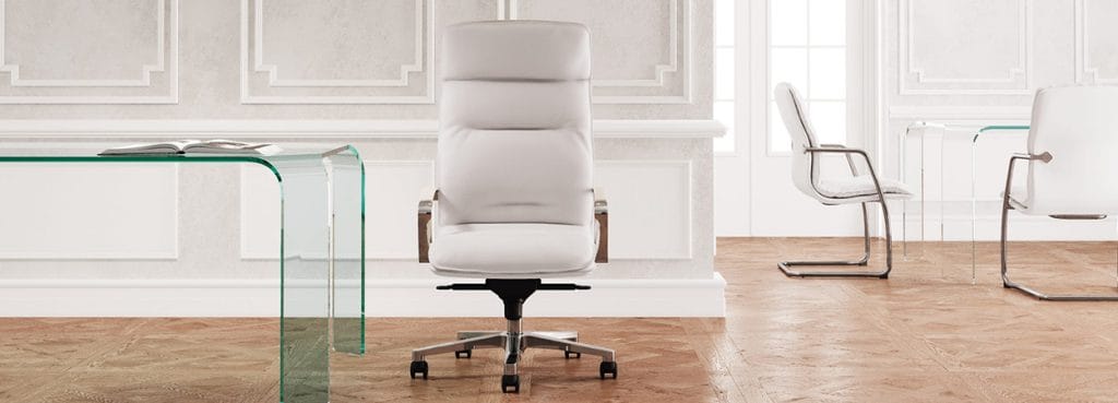 White Formen executive chair with a high back, set in a modern office space.