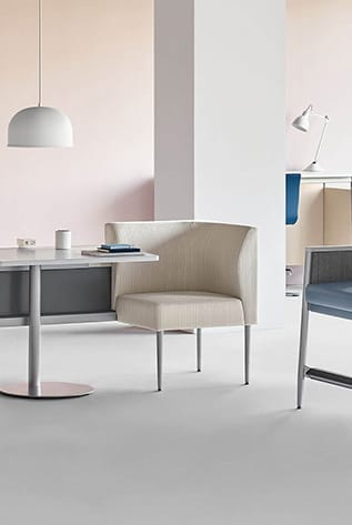 Modern Healthcare Furniture: Beige chair with attached table, clean design. Ideal for waiting areas and patient rooms.