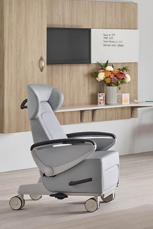 Ergonomic gray Healthcare Furniture chair with wheels, designed for patient comfort and mobility.