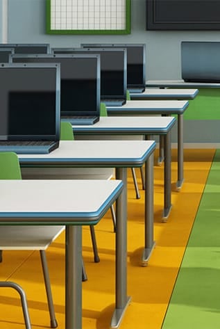 Classroom with laptops, tables, and chairs. Modern furniture for higher education.