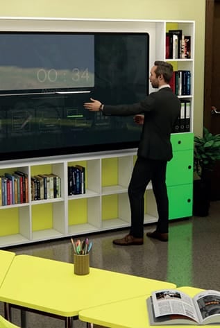 Modern Higher Education furniture: interactive whiteboard, shelving, and bright yellow tables.