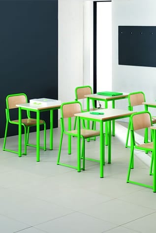 Classroom with green metal frame School Furniture, wood seats, and white tabletops.