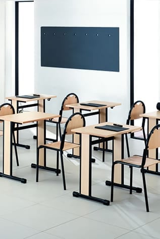 Classroom with light wood School Furniture and black metal frames.