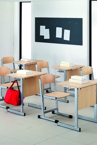 Classroom featuring light wood School Furniture with silver frames.