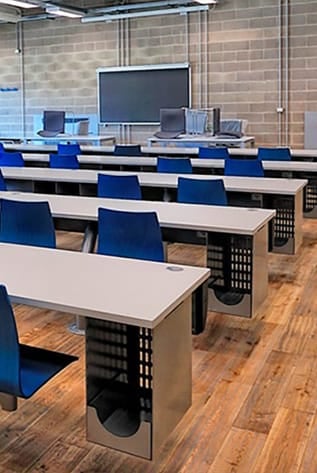 Modern Lecture Halls with blue seating, integrated writing surfaces, and ergonomic design for optimal learning.