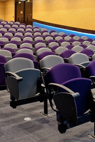 Rows of purple and gray seating in modern Lecture Halls.
