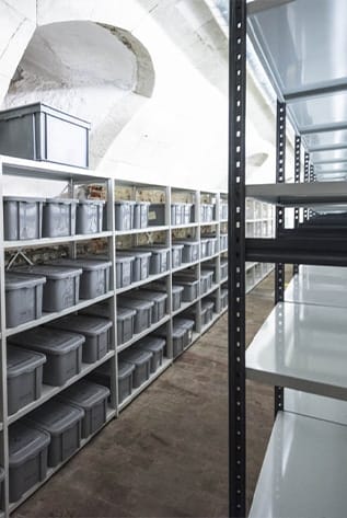 Efficient Warehouse Storage Solutions with durable metal shelving and gray storage boxes.