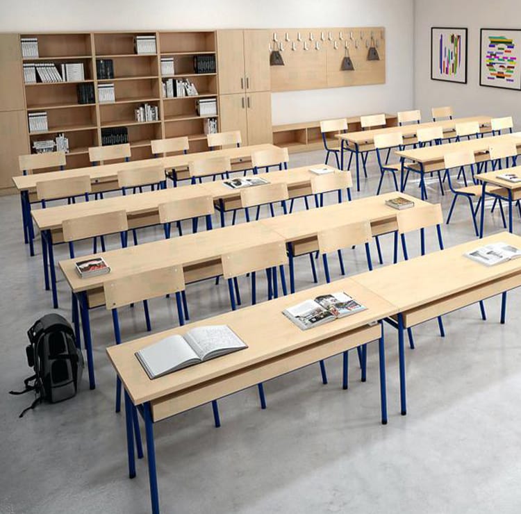 Classroom furniture for Higher Education. Light wood desks with blue metal frames. Functional learning spaces.