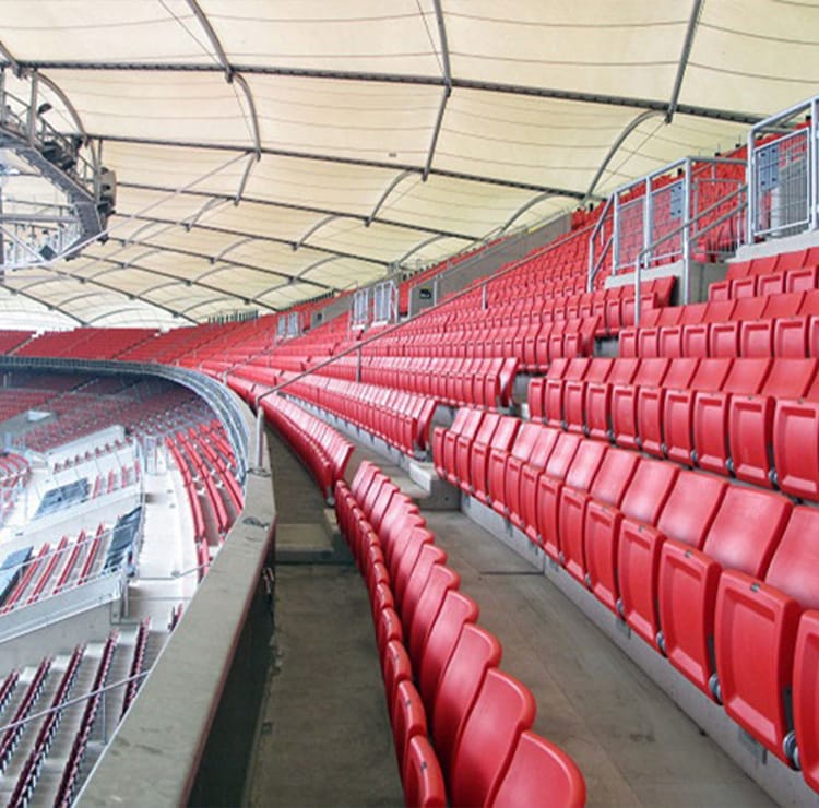 Red stadium seats. Seating and Staging Solutions for venues, comfort, and durability.