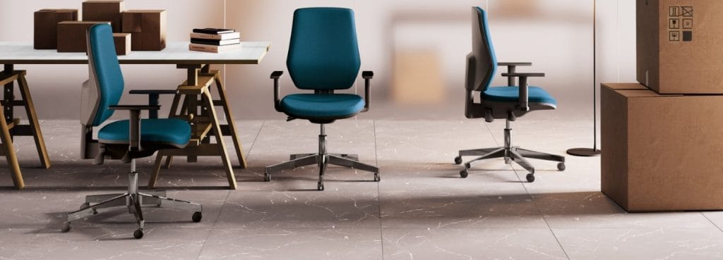 Modern office seating: Blue Cast task chairs with adjustable arms and chrome bases.