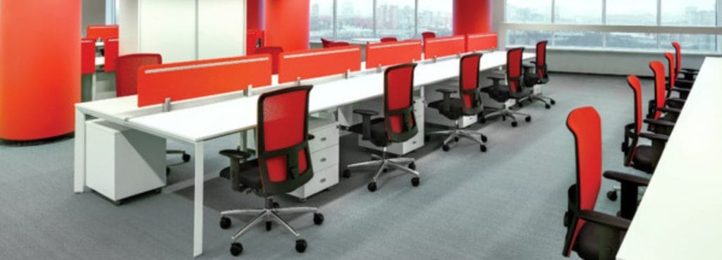 Open office featuring Interstuhl Goal-Air 172G chairs with red mesh backs.