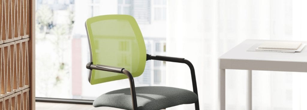 Essai visitor chair with green mesh back, gray seat, and black cantilever frame.