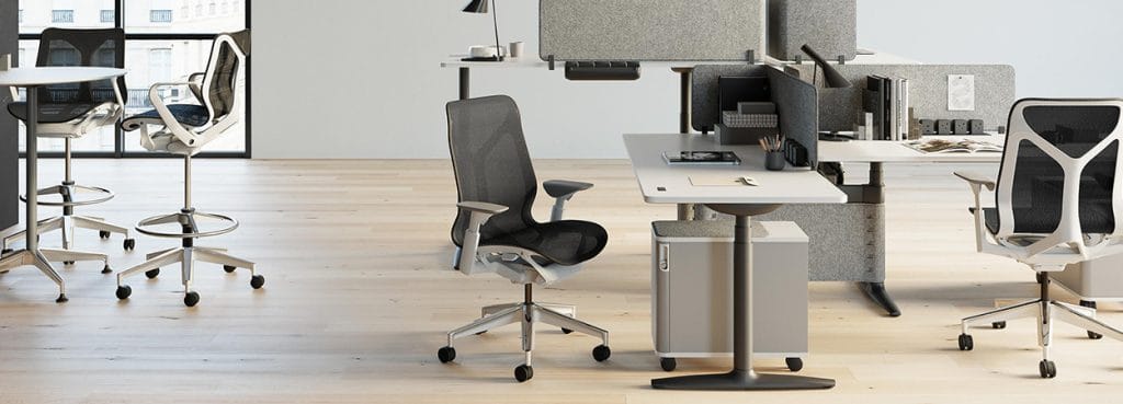 Modern office featuring the ergonomic Cosm Stool by Herman Miller. Sleek design, mesh back, and adjustable height. Perfect for social spaces.