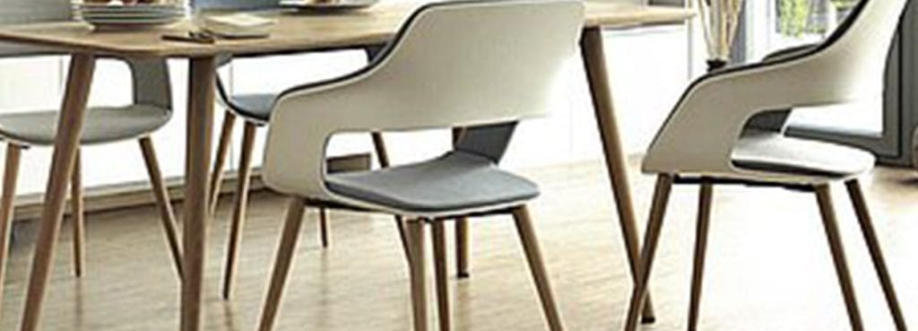 OCCO chair in a meeting room setting. Modern design with light upholstery and wooden legs.