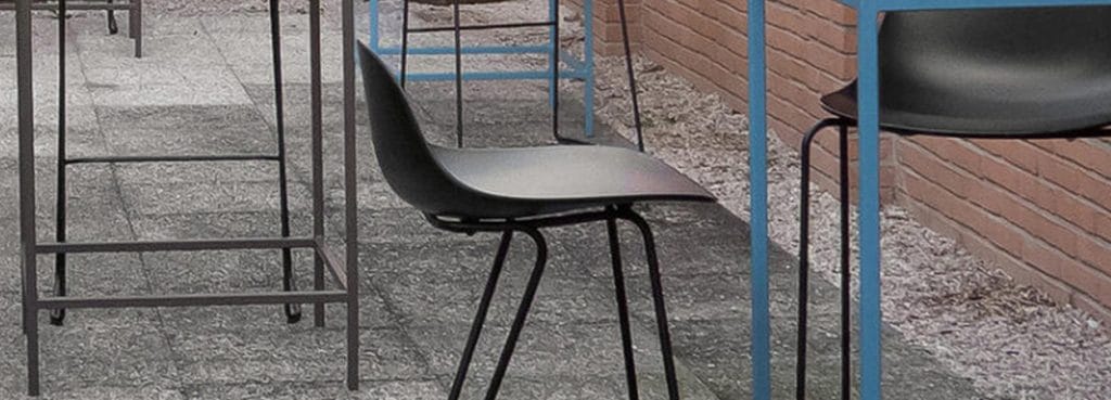 Close-up of a black Pure Loop Mini Stool with a sleek, ergonomic design and metal legs.