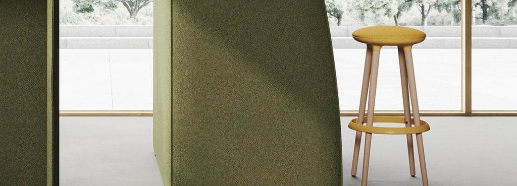 Modern yellow Zoom Stool with wooden legs, perfect for social and relaxed spaces.