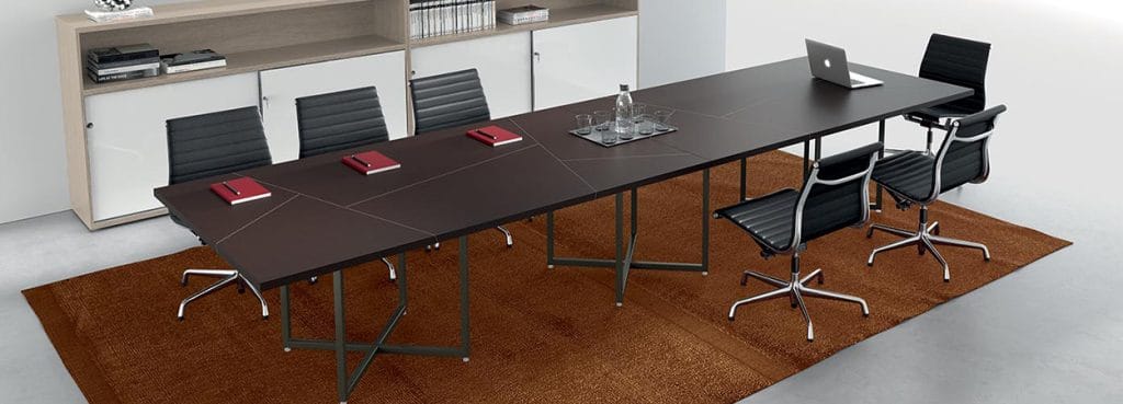 Sleek IBIS Conference Table. Modern design with a dark wood finish, metal legs, and seating for collaborative workspaces.