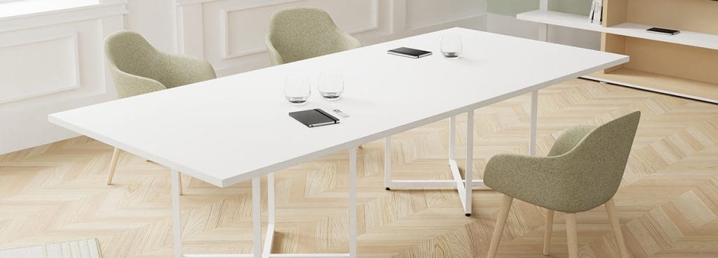 Minimalist IBIS desk by Alea Office with white tabletop and light green chairs, ideal for modern workspaces.