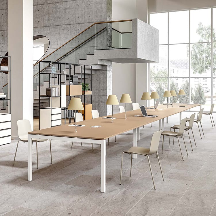 Contemporary Italo_Forty Conference Table with a light wood top and white frame in a modern office space.