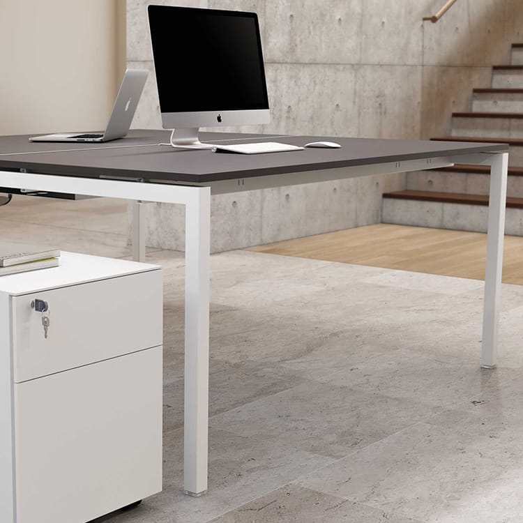 Modern Italo_Forty desk with white frame, gray top, and computer. Cost-efficient workstation system for open spaces.