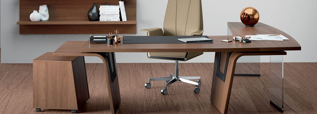 Larus executive desk in wood with a gull-wing leg design, paired with a beige office chair.