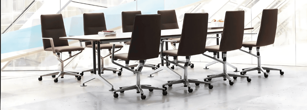 Wilkhahn Logon Conference Table with brown chairs, metal legs, and a light tabletop.