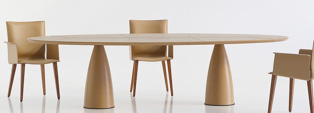 Elegant Mythos Conference Table in light brown with matching chairs, perfect for modern collaboration spaces.