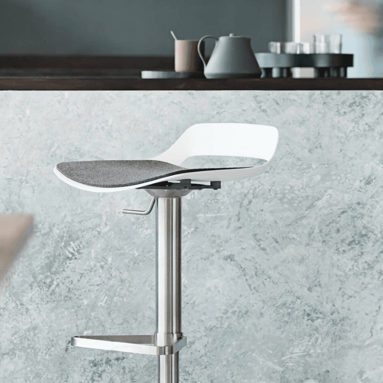 Modern Occo Stool by Wilkhahn. White shell, gray seat, and stainless steel base. Ergonomic seating for social spaces.