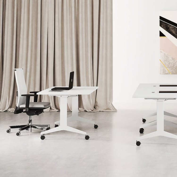 Minimalist white OYO Table by Las Mobili with foldable features, paired with a chair and laptop, optimizing space.