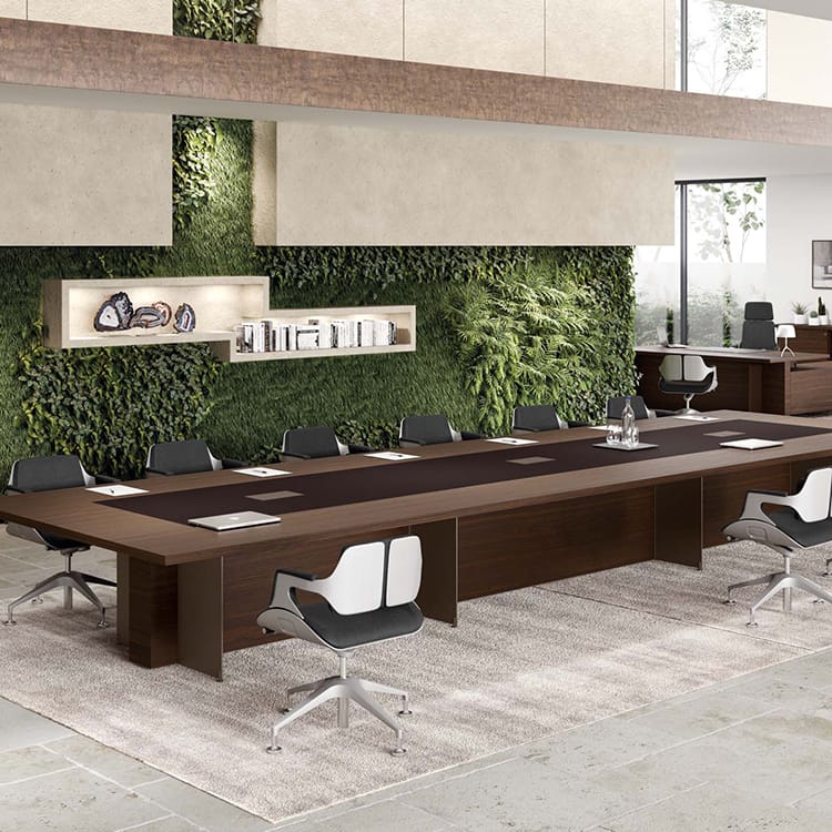 Oasi Executive Meeting Table in wood finish with modern chairs, ideal for collaboration spaces.