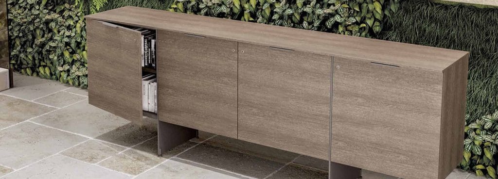 Modern Oasi Sideboard in wood grain finish with sleek metal legs. Office storage solution.