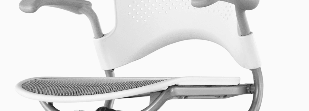 Close-up of a white and gray Caper Stool by Herman Miller.