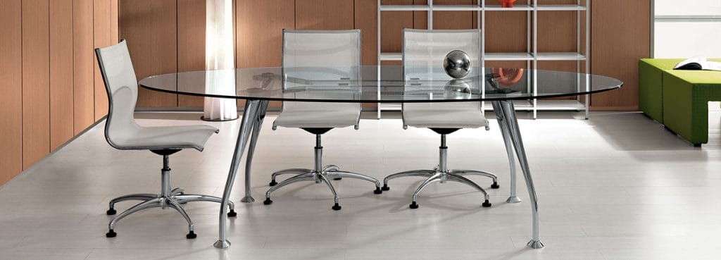 Modern SEGNO executive desk with a glass top and metal legs, paired with sleek office chairs.