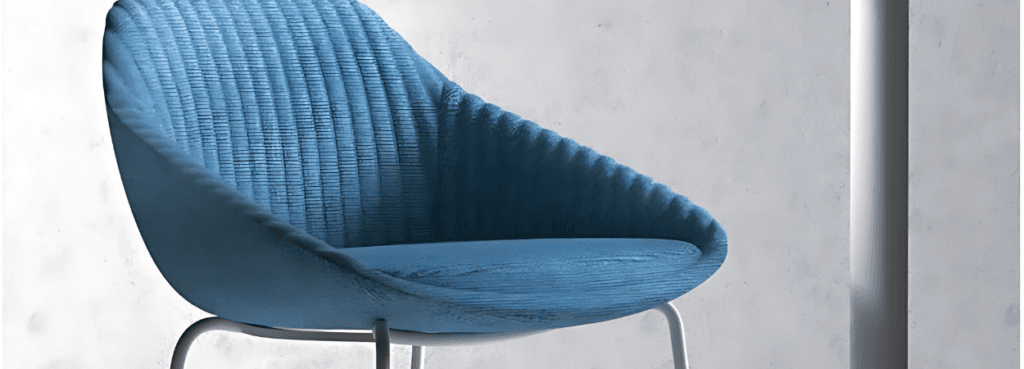 Close-up of a blue SYS Stool with a cushioned seat and metal legs, ideal for lounge or office spaces.