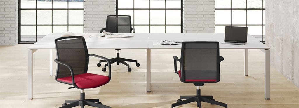 Troupe task chair with breathable mesh back, red seat, and black frame. Ergonomic office seating.
