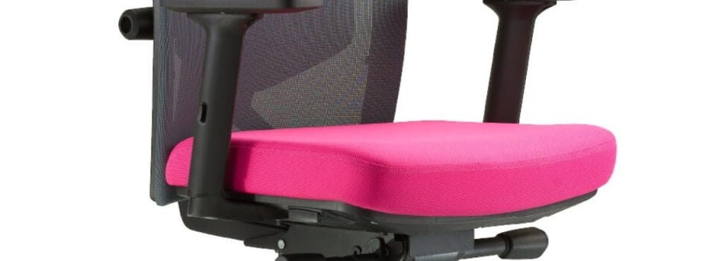 Close-up of a Tune office chair with a pink seat and mesh back.
