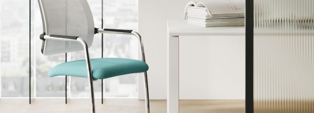 Rassegna cantilever visitor chair with teal seat and chrome frame.